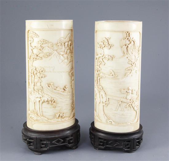 A pair of Chinese ivory vases, early 20th century, 28 and 28.5cm, later holes to stands